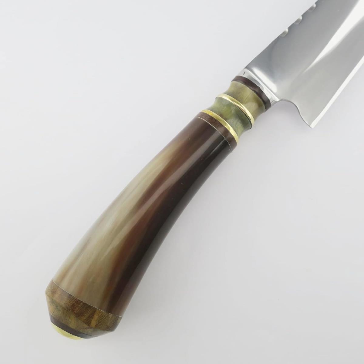 A high-quality 7.1-inch stainless steel knife featuring a unique handle made from combined cow horn and wood, accented with brass rings. Perfect for kitchen use, blending durability with a distinctive aesthetic.