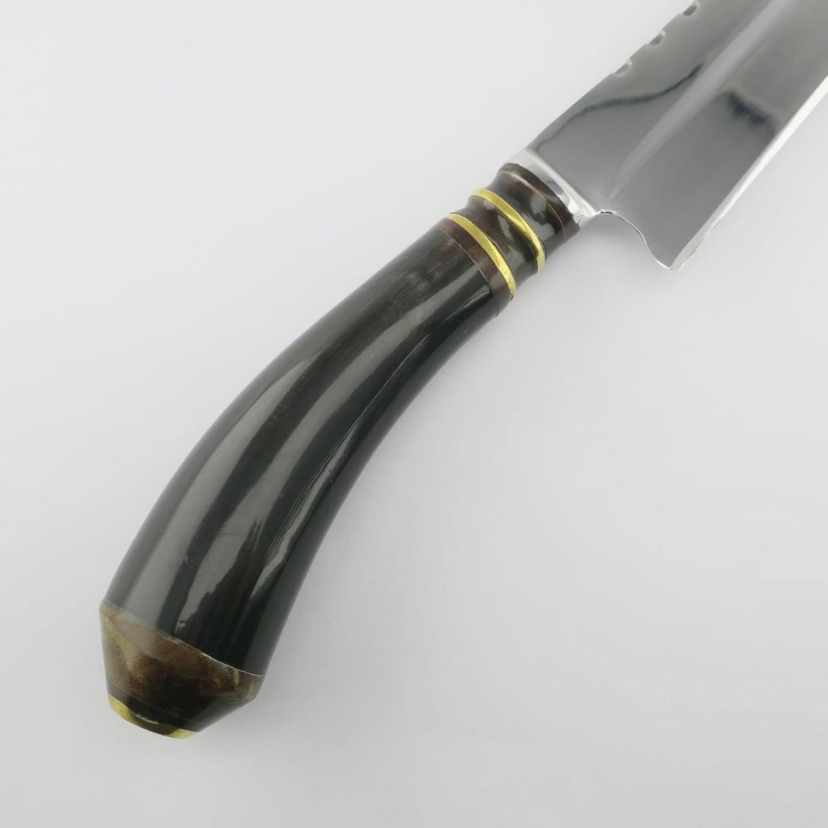 A Cow 7.1in Dark stainless steel knife with a dark, curved handle and gold-colored bands, shown from the handle up to the beginning of the blade on a white background. This knife is ideal for kitchen tasks.