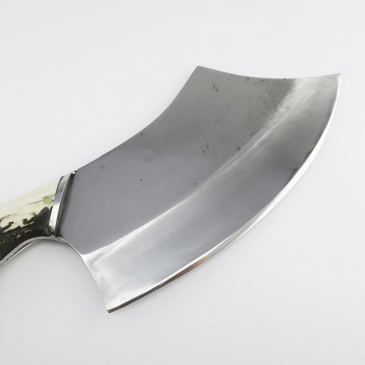 Close-up of a 7.68-inch black steel hatchet with a unique deer antler handle, showcasing the curved blade and rustic design. Perfect for collectors and outdoor enthusiasts.