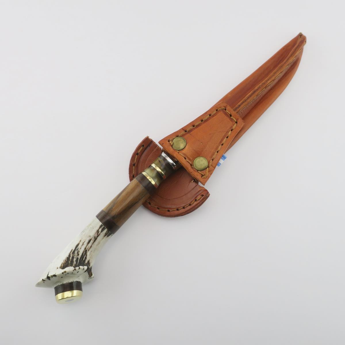 5.5-inch stainless steel knife with a deer antler handle and a brown leather sheath, perfect for outdoor enthusiasts and collectors.