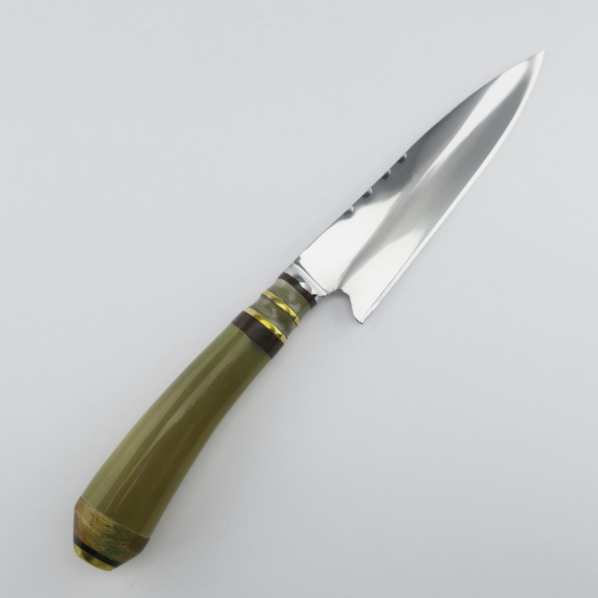 Cow 5.5 inch Light stainless steel knife with a green handle and golden accents, featuring a serrated spine and polished blade. Ideal for kitchen tasks.