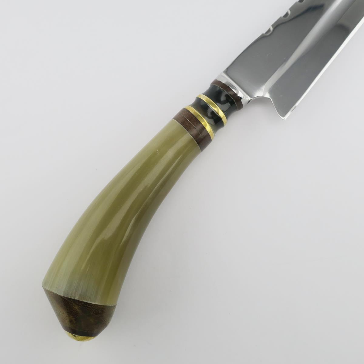 A Cow 5.5in Light stainless steel knife with a polished blade and a unique handle featuring light green, dark brown, and gold ring accents, perfect for kitchen tasks.