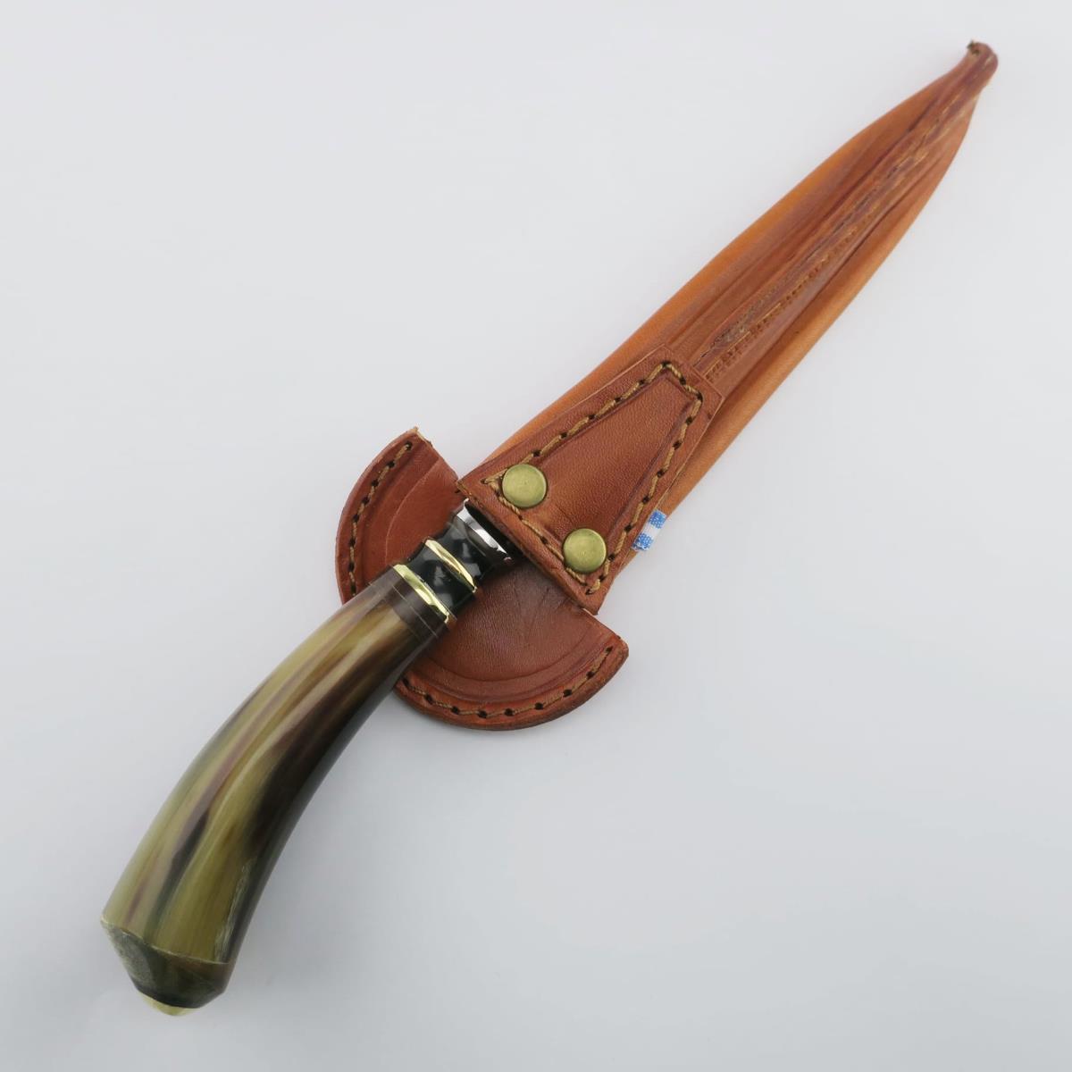 6.3-inch cow knife with stainless steel blade and natural horn handle, accompanied by a custom brown leather sheath. Perfect for collectors or outdoor enthusiasts, this unique handcrafted knife offers durability and an authentic look.